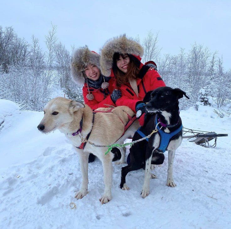 two women with dogs